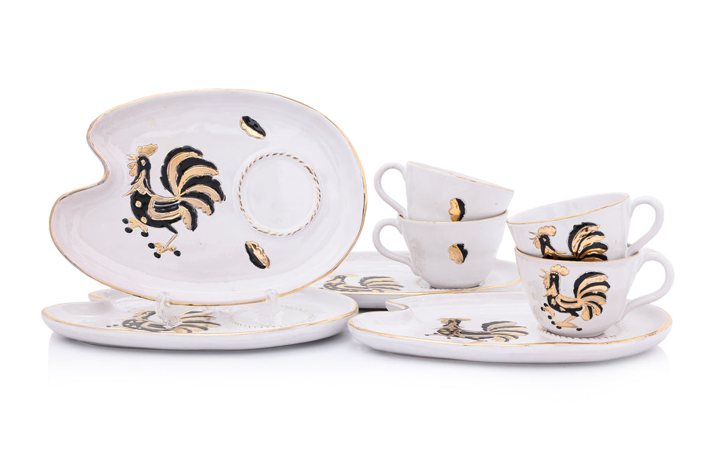 A SET OF FOUR ITALIAN CERAMIC CUPS AND SAUCERS