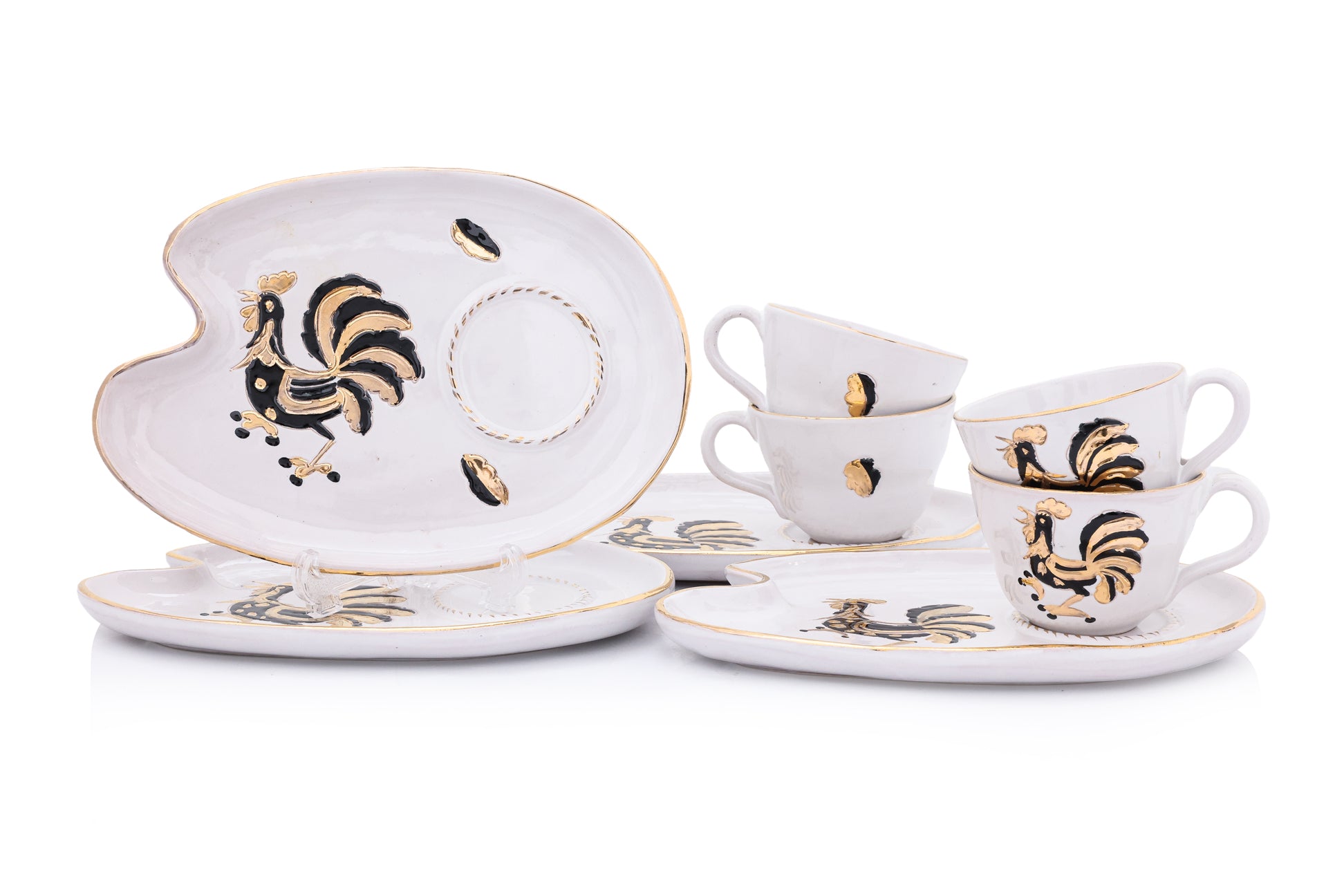 A SET OF FOUR ITALIAN CERAMIC CUPS AND SAUCERS