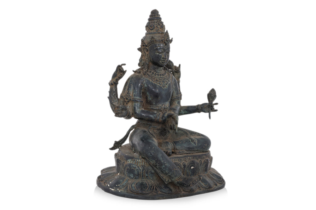 A BRONZE MODEL OF SEATED SHIVA