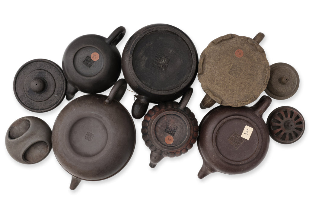 A GROUP OF SIX YIXING ZISHA POTTERY TEAPOTS