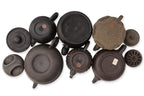 A GROUP OF SIX YIXING ZISHA POTTERY TEAPOTS