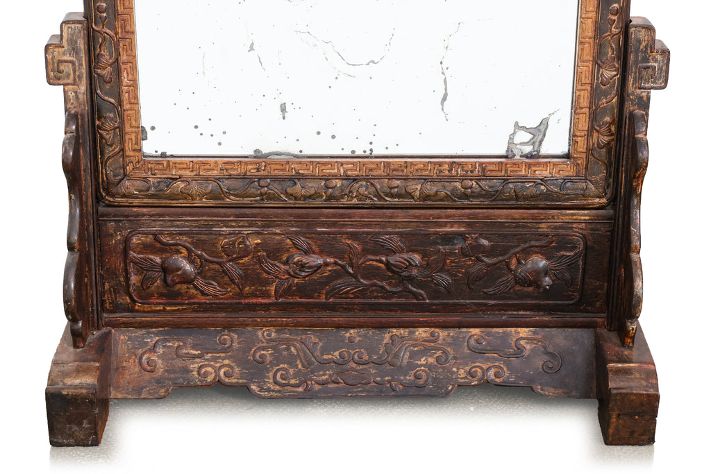 A CARVED HARDWOOD TABLE MIRROR