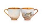 A HARLEQUIN SET OF ELEVEN ROYAL WORCESTER 'GAME BIRDS' PORCELAIN COFFEE CUPS AND SAUCERS (11)