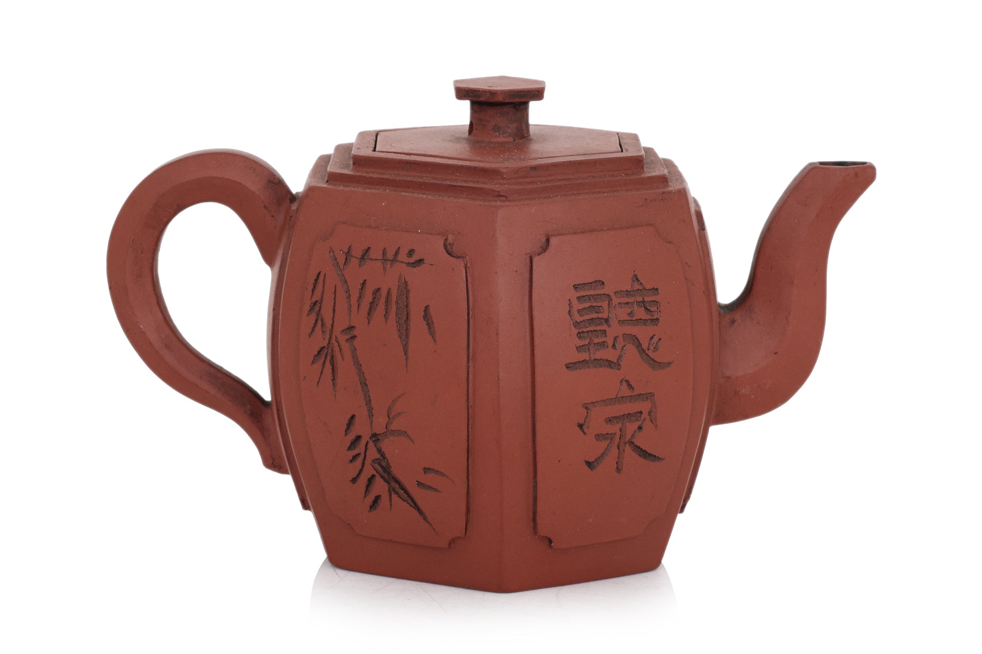A YIXING POTTERY TEAPOT AND COVER
