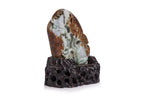 A CARVED GREEN AND RUSSET JADEITE BOULDER