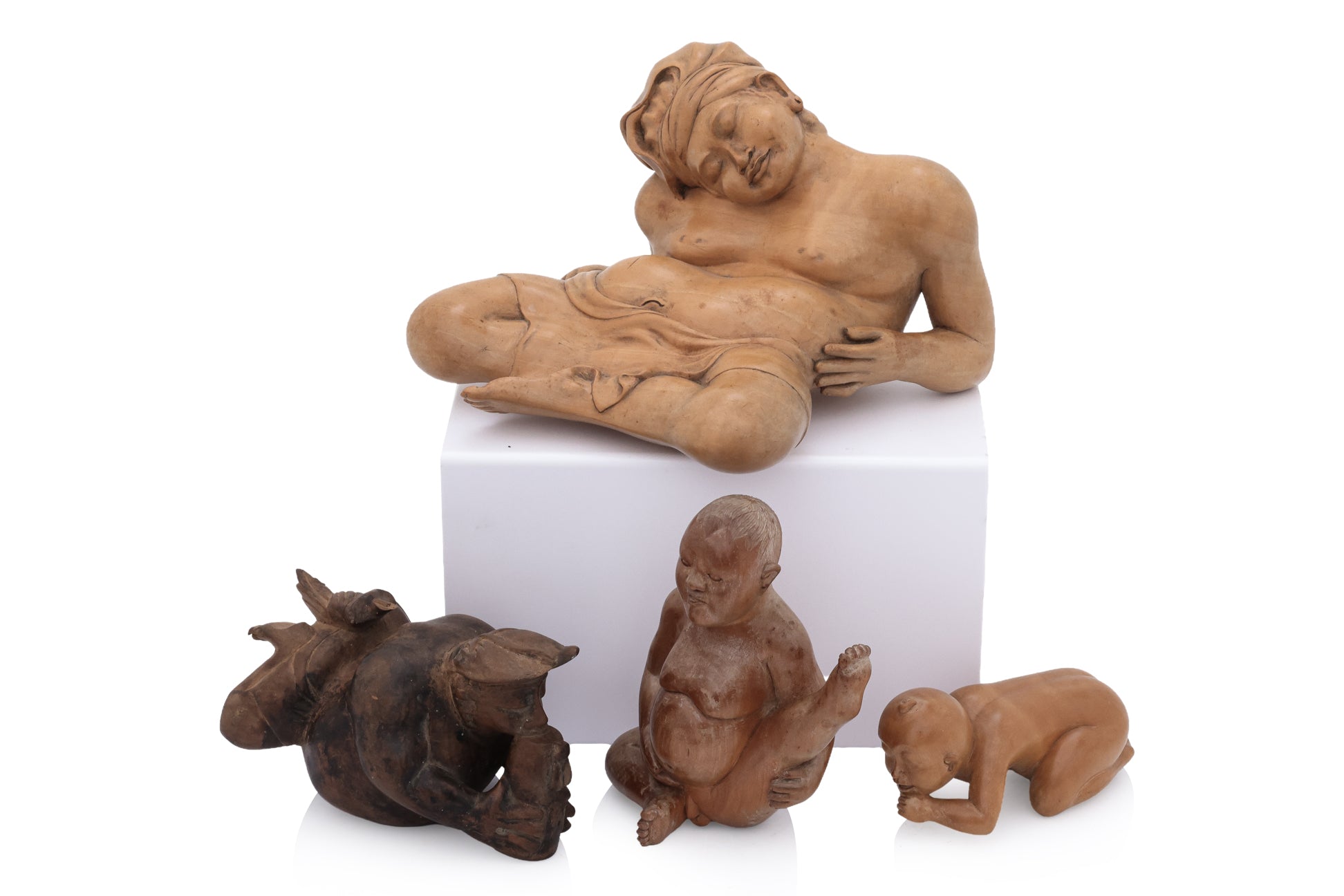 A GROUP OF FIVE BALINESE WOOD CARVINGS