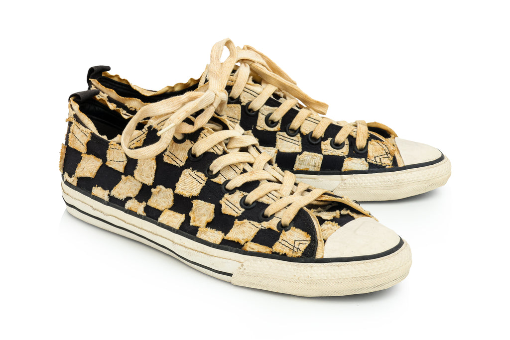 ISSEY MIYAKE - A PAIR OF BLACK AND BEIGE CHECKERED CANVAS TRAINERS