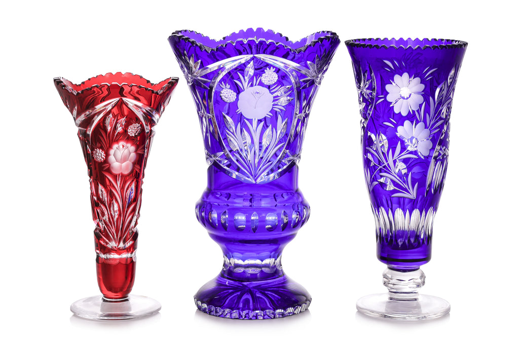 THREE LARGE COLOURED CUT TO CLEAR CRYSTAL VASES