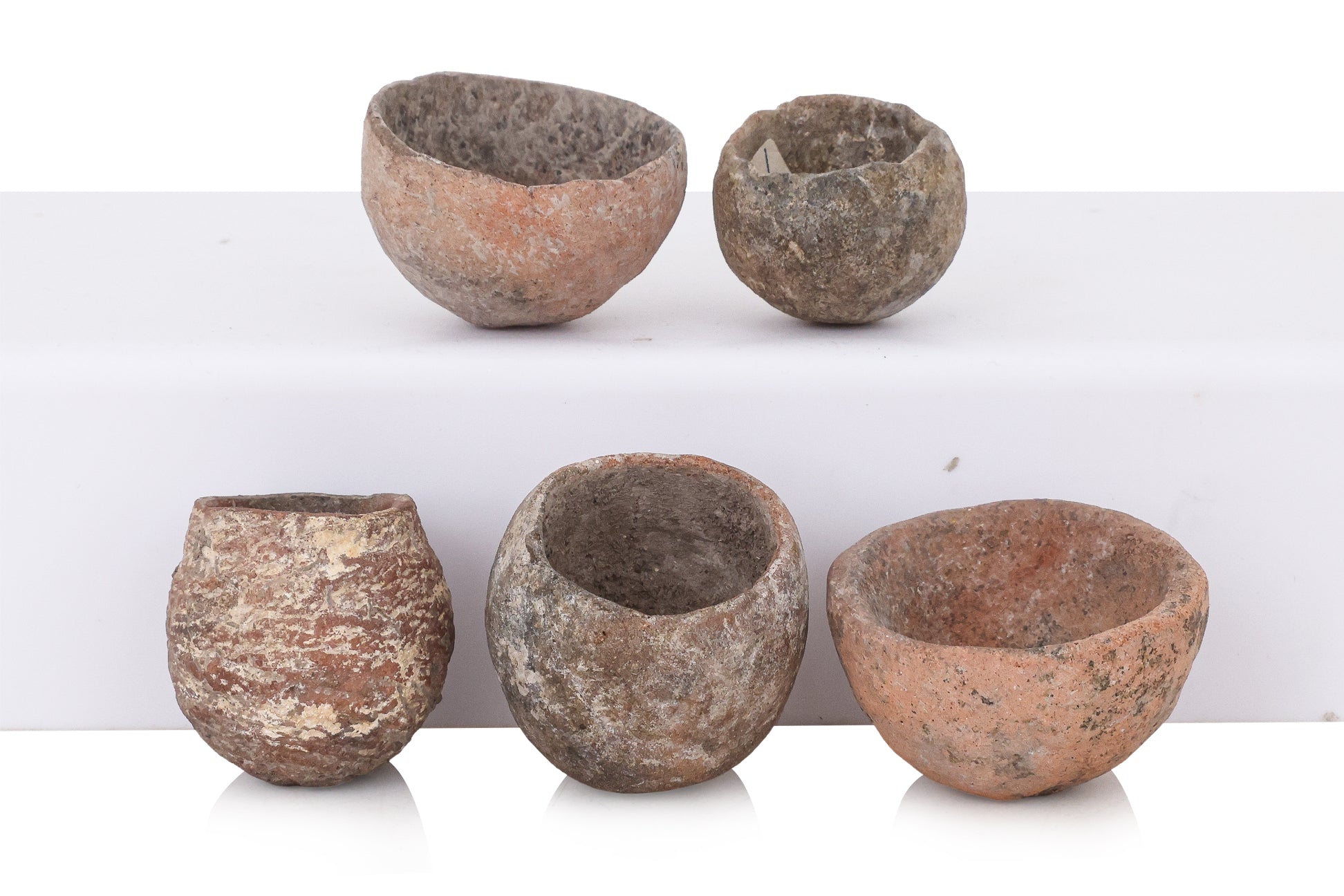 A GROUP OF TEN MINIATURE BAN CHIANG STYLE POTTERY VESSELS