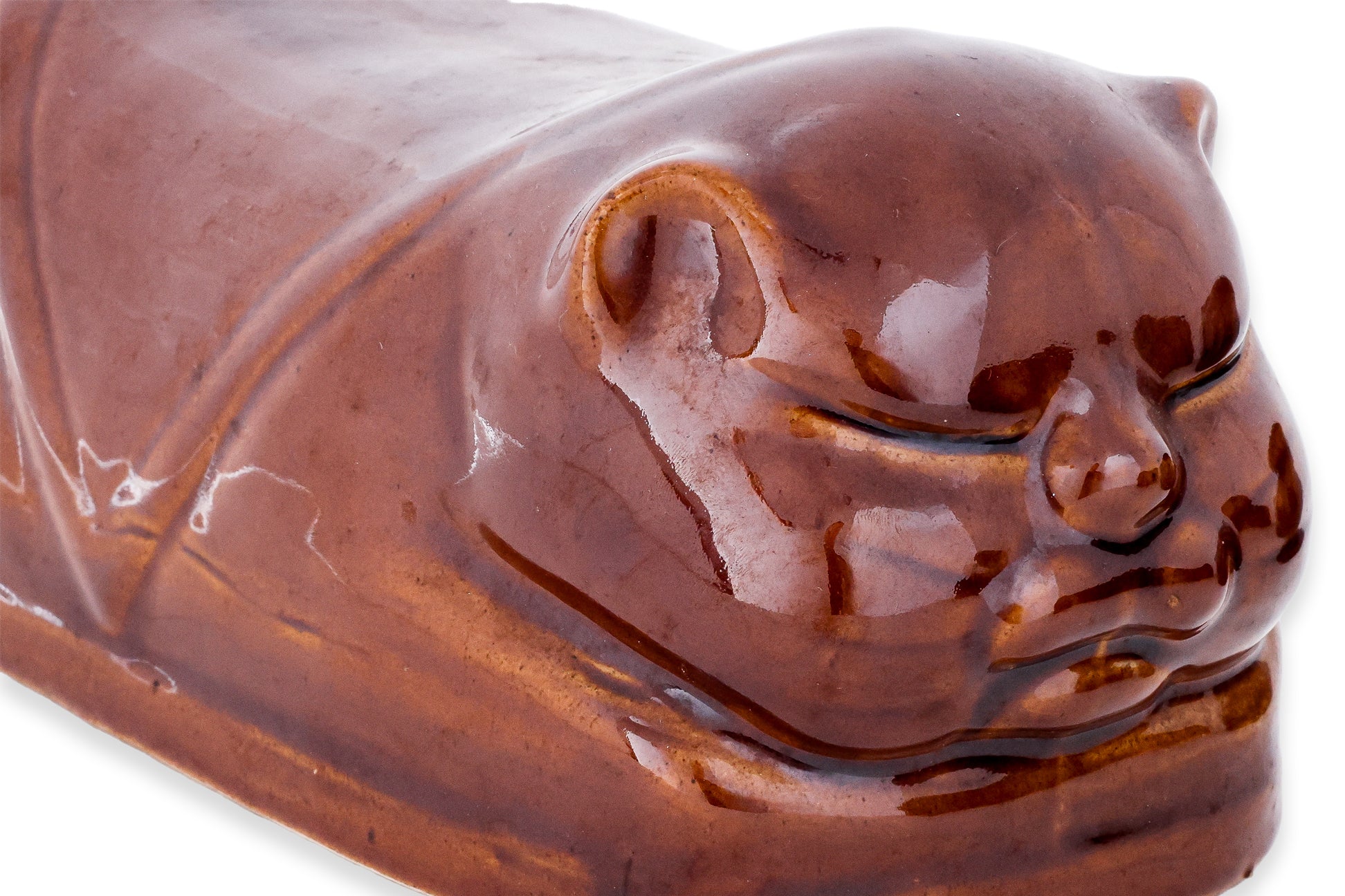 A GROUP OF THREE BROWN GLAZED CERAMIC PILLOW MONEY BOXES