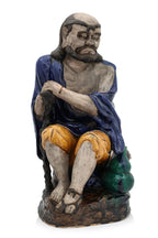 A LARGE SHIWAN POTTERY FIGURE OF A SEATED LUOHAN