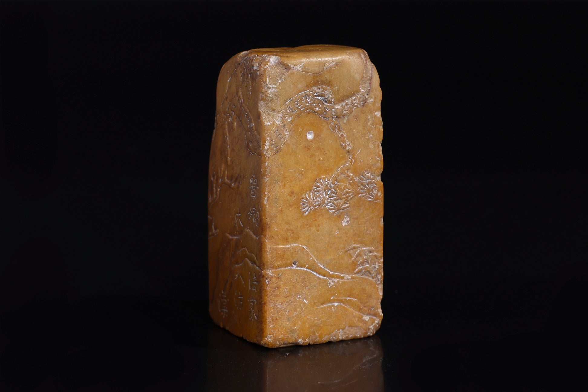 A CARVED AND INSCRIBED SOAPSTONE SEAL