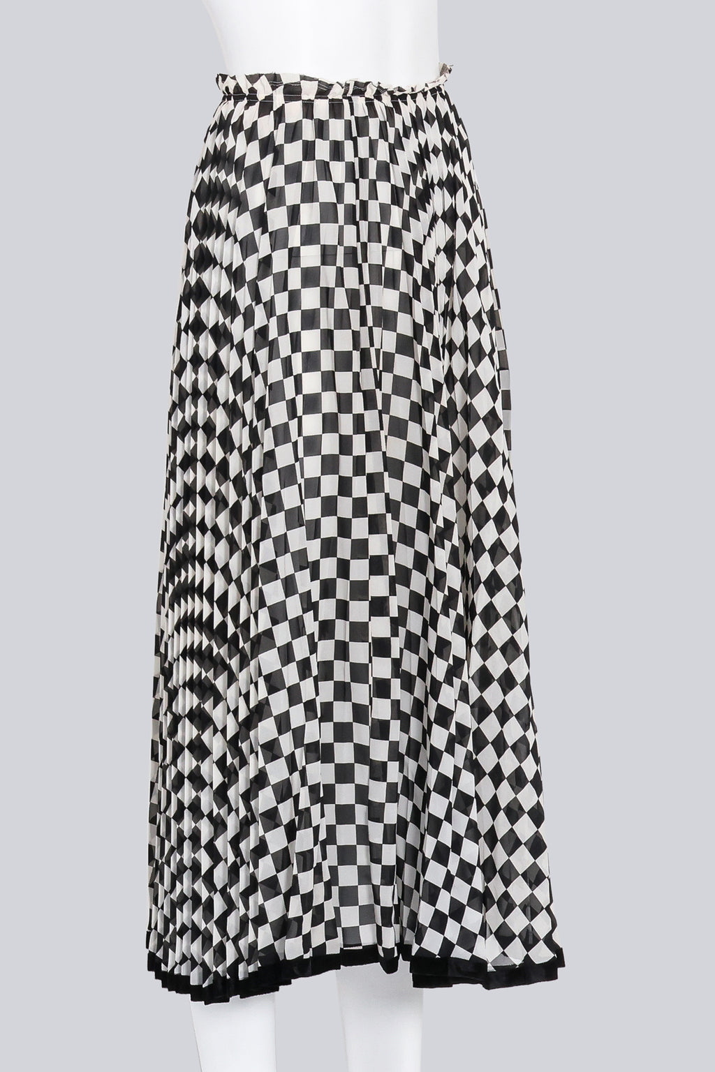 COMME DES GARCONS - A BLACK AND WHITE CHECKERED SKIRT