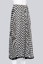 COMME DES GARCONS - A BLACK AND WHITE CHECKERED SKIRT
