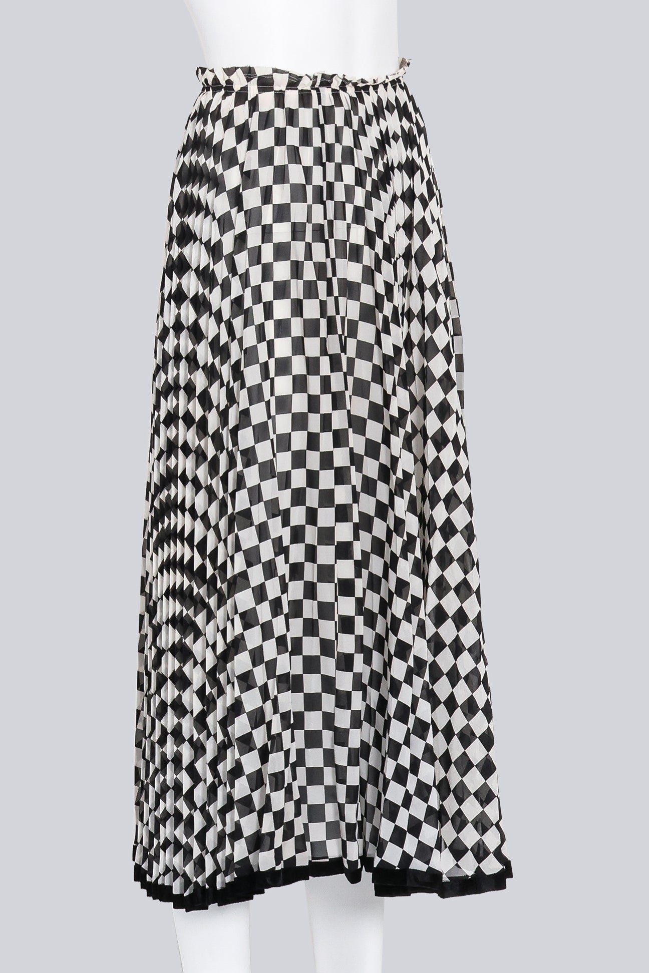 COMME DES GARCONS - A BLACK AND WHITE CHECKERED SKIRT
