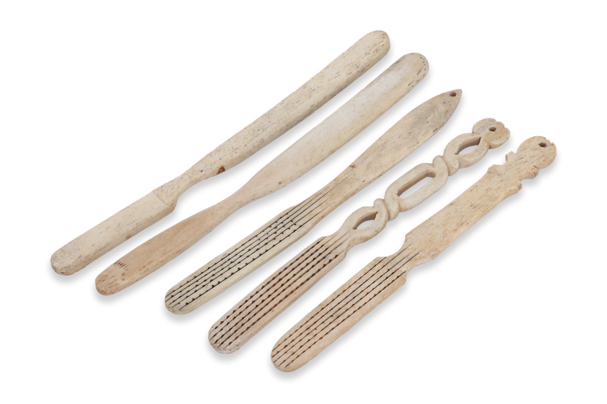 A GROUP OF FIVE BONE TOOTHBRUSHES