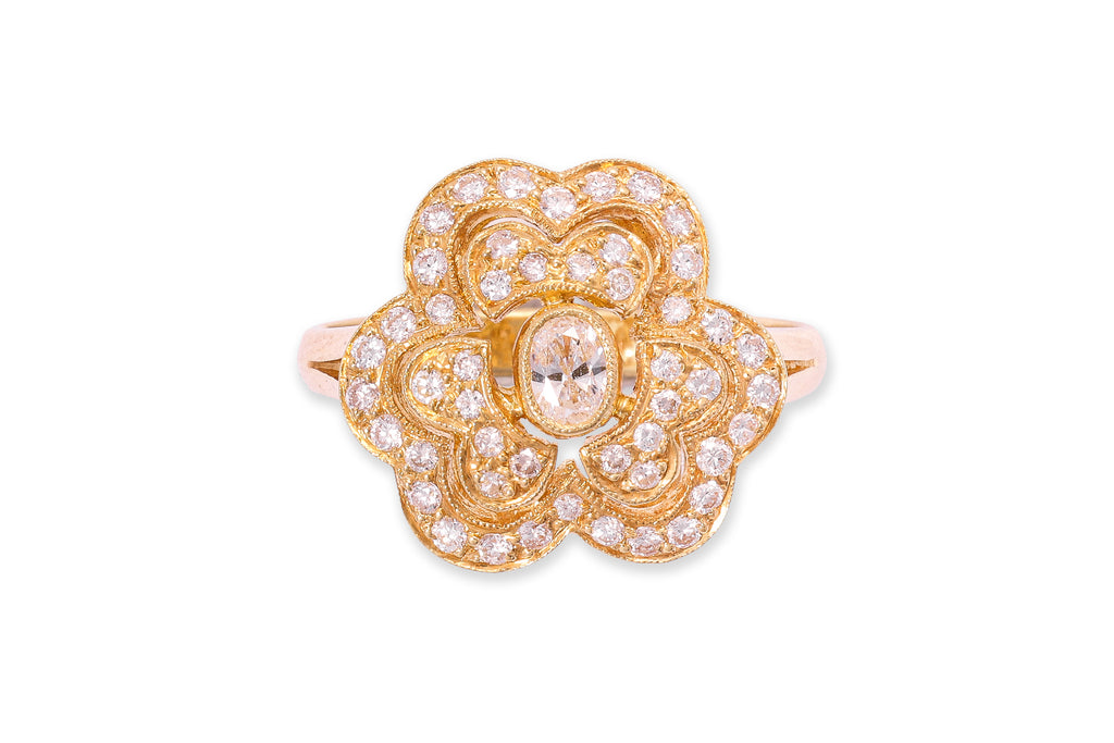 A HIGH KARAT GOLD DIAMOND 'FLOWER' RING