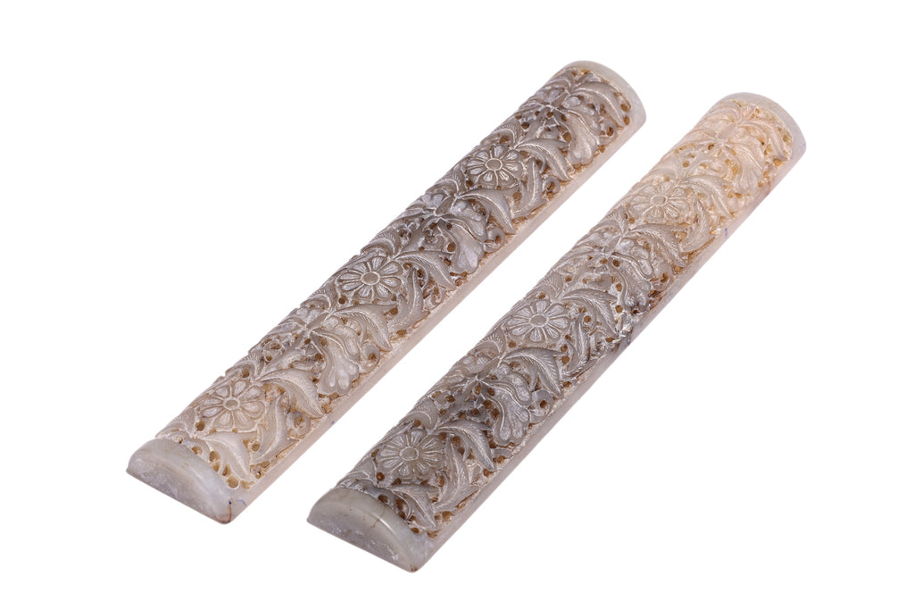 A PAIR OF CARVED JADE WRIST RESTS
