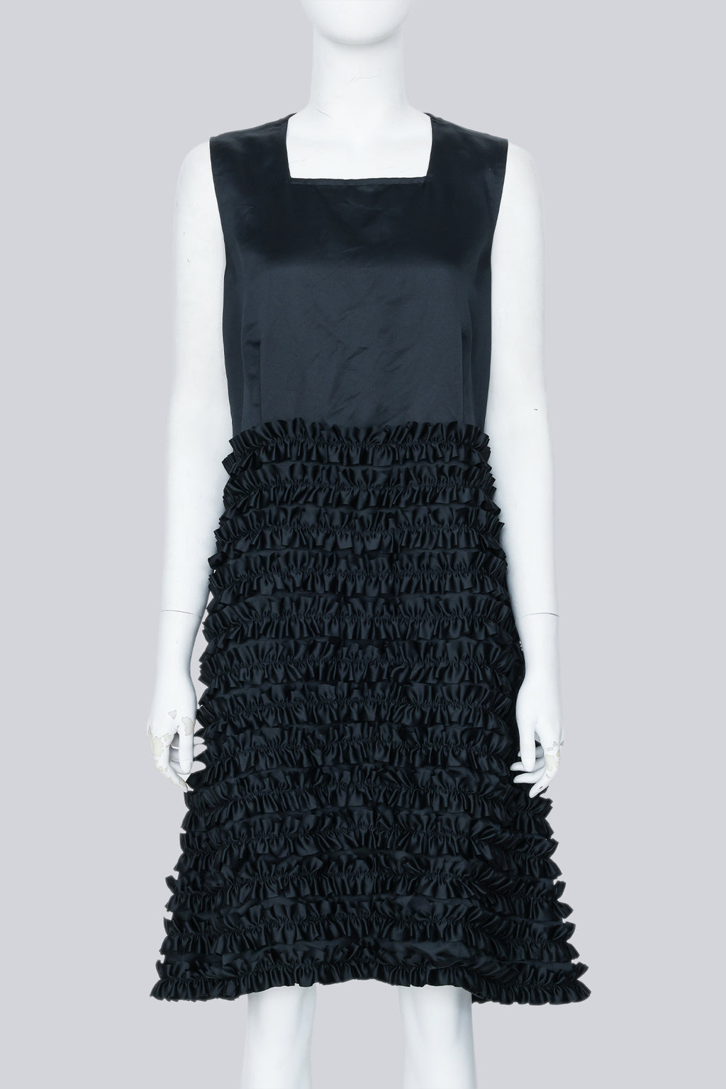 COMME DES GARÇONS - A BLACK SLEEVELESS DRESS WITH RUFFLED SKIRT