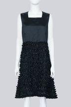COMME DES GARÇONS - A BLACK SLEEVELESS DRESS WITH RUFFLED SKIRT