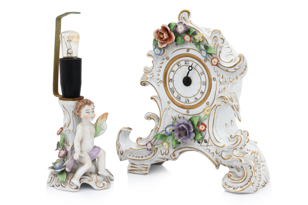 A GROUP OF FIVE GERMAN PORCELAIN FIGURES AND A CLOCK