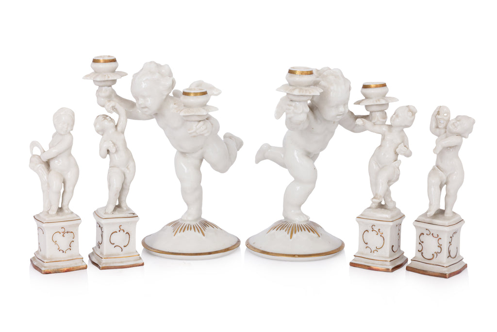 A GROUP OF SIX HUTSCHENREUTHER PORCELAIN FIGURES OF CHERUBS