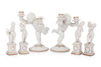 A GROUP OF SIX HUTSCHENREUTHER PORCELAIN FIGURES OF CHERUBS