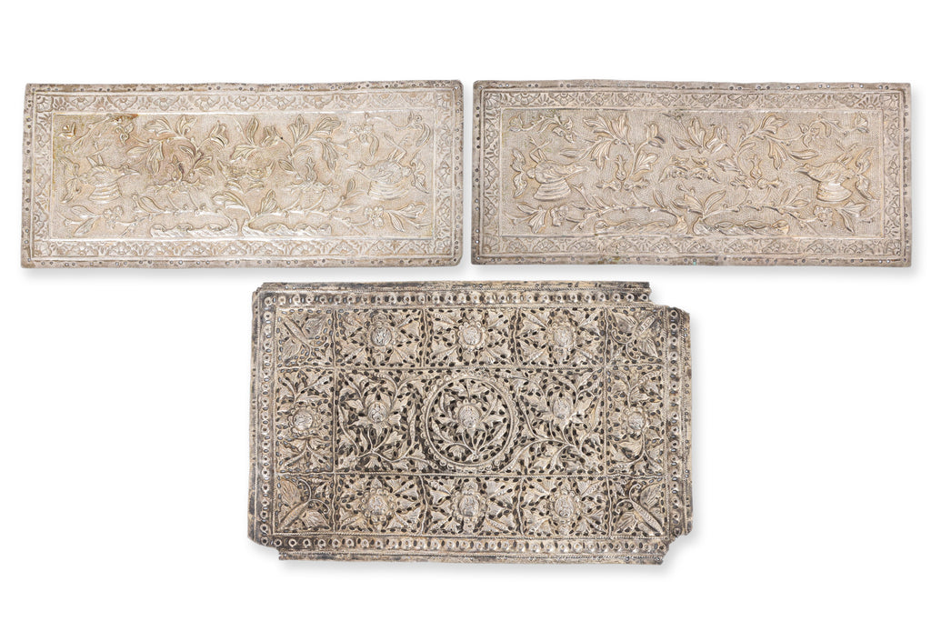 A GROUP OF SIX SILVER PILLOW AND BOLSTER ENDS