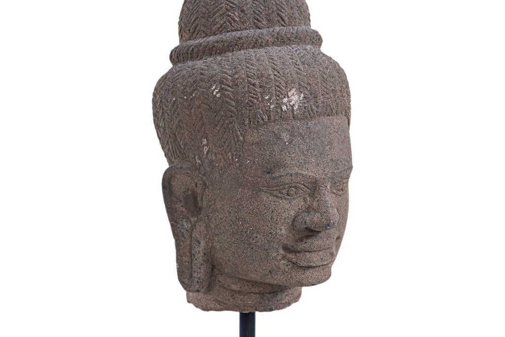 A CAMBODIAN KHMER CARVED STONE HEAD OF A DEITY