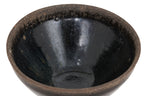 A BLACK GLAZED STONEWARE BOWL