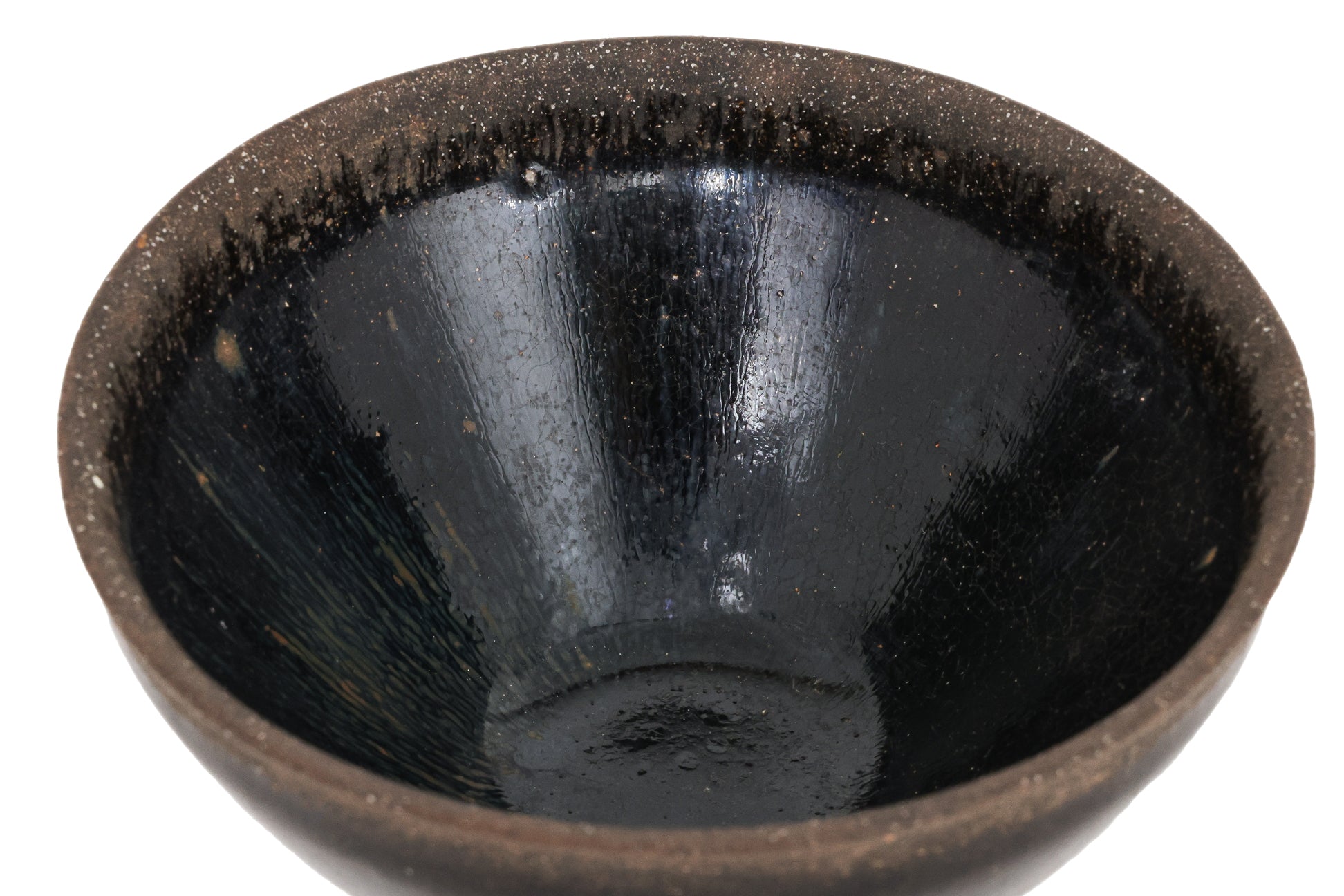 A BLACK GLAZED STONEWARE BOWL