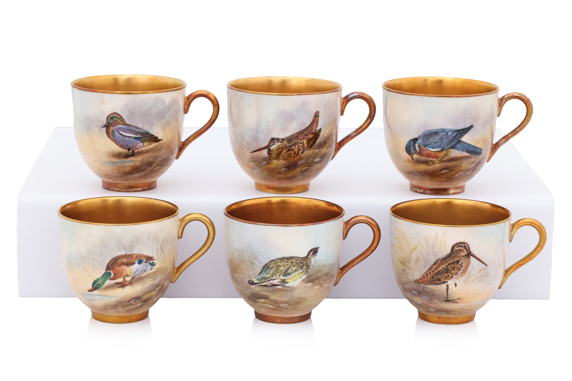 A HARLEQUIN SET OF ELEVEN ROYAL WORCESTER 'GAME BIRDS' PORCELAIN COFFEE CUPS AND SAUCERS (11)