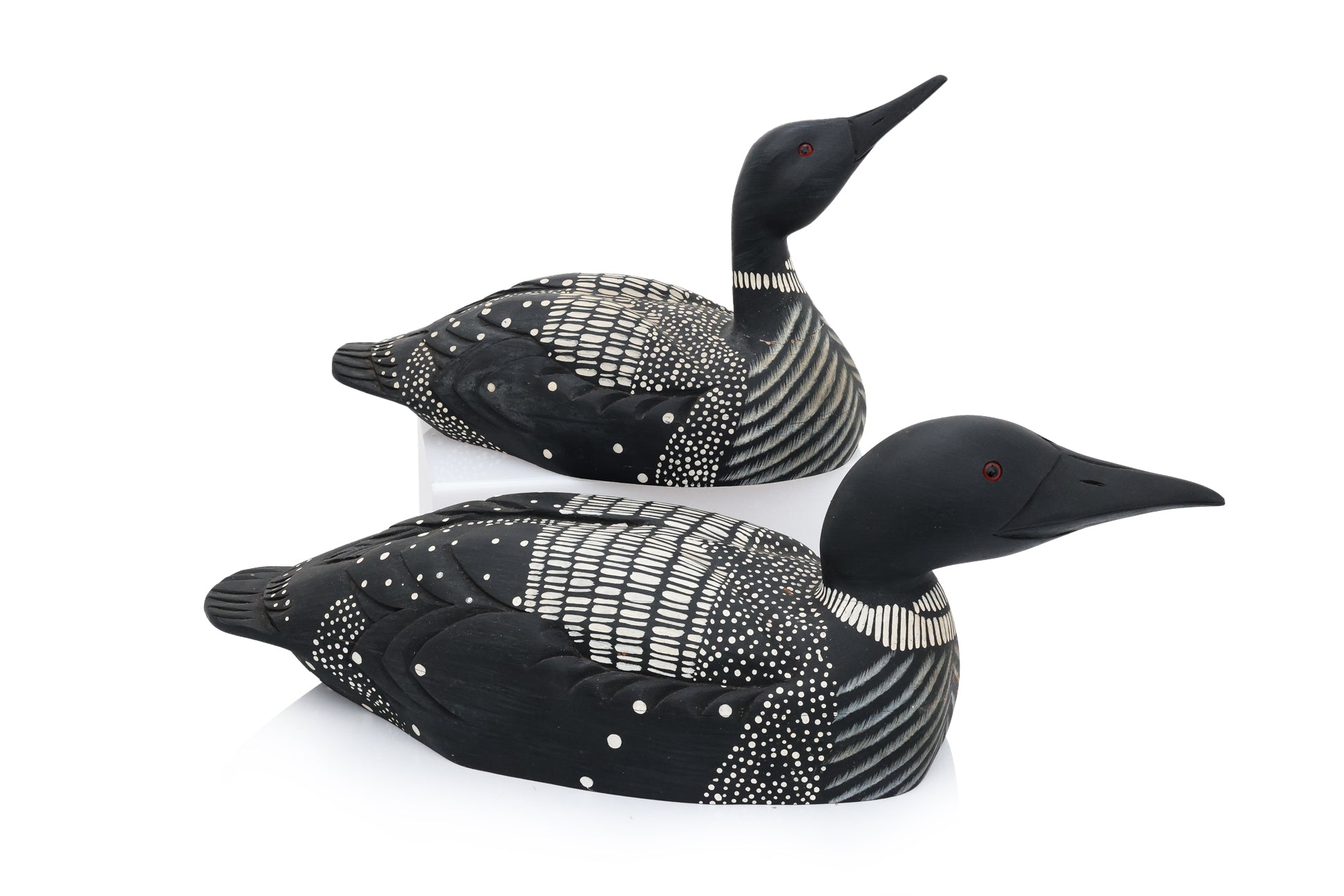 TWO CARVED AND PAINTED WOODEN DUCK DECOYS BY JAMES HADDON