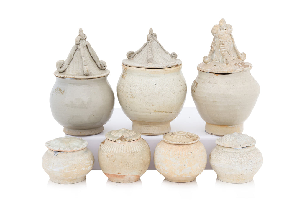A GROUP OF QINGBAI-GLAZED JARS AND COVERS