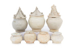 A GROUP OF QINGBAI-GLAZED JARS AND COVERS