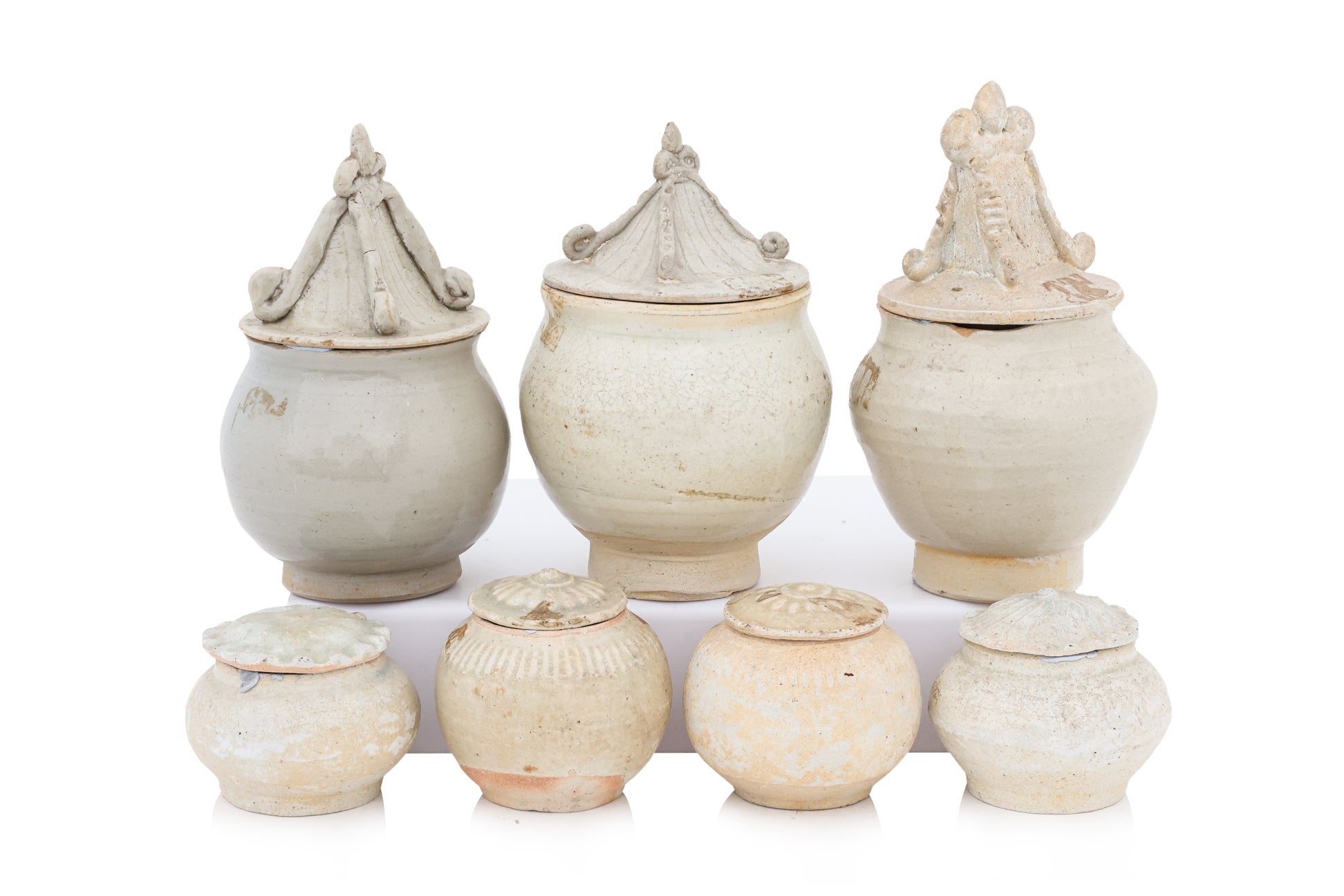 A GROUP OF QINGBAI-GLAZED JARS AND COVERS