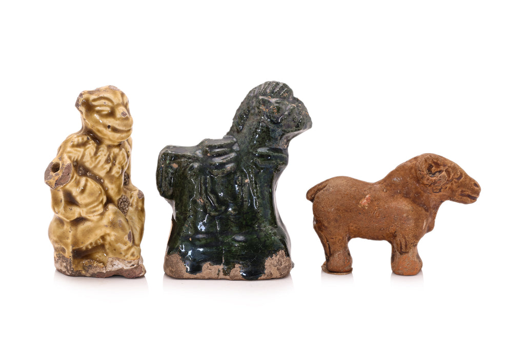 A GROUP OF SIX POTTERY FIGURES
