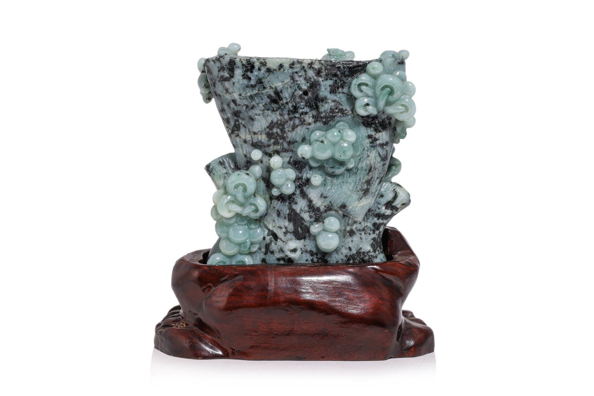 A CARVED GREEN JADE SCULPTURE