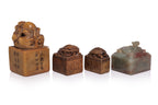 A GROUP OF SEVEN CARVED STONE SEALS
