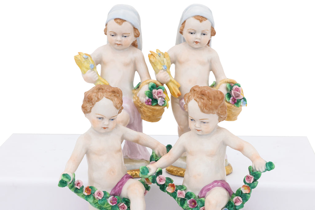 A GROUP OF EIGHT SITZENDORF PORCELAIN FIGURES OF PUTTI