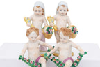 A GROUP OF EIGHT SITZENDORF PORCELAIN FIGURES OF PUTTI
