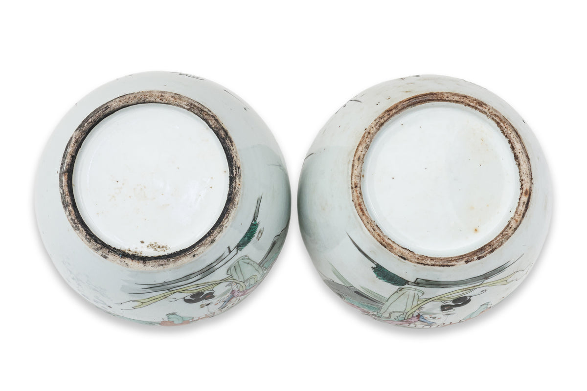 A PAIR OF FAMILLE ROSE JAR AND COVERS