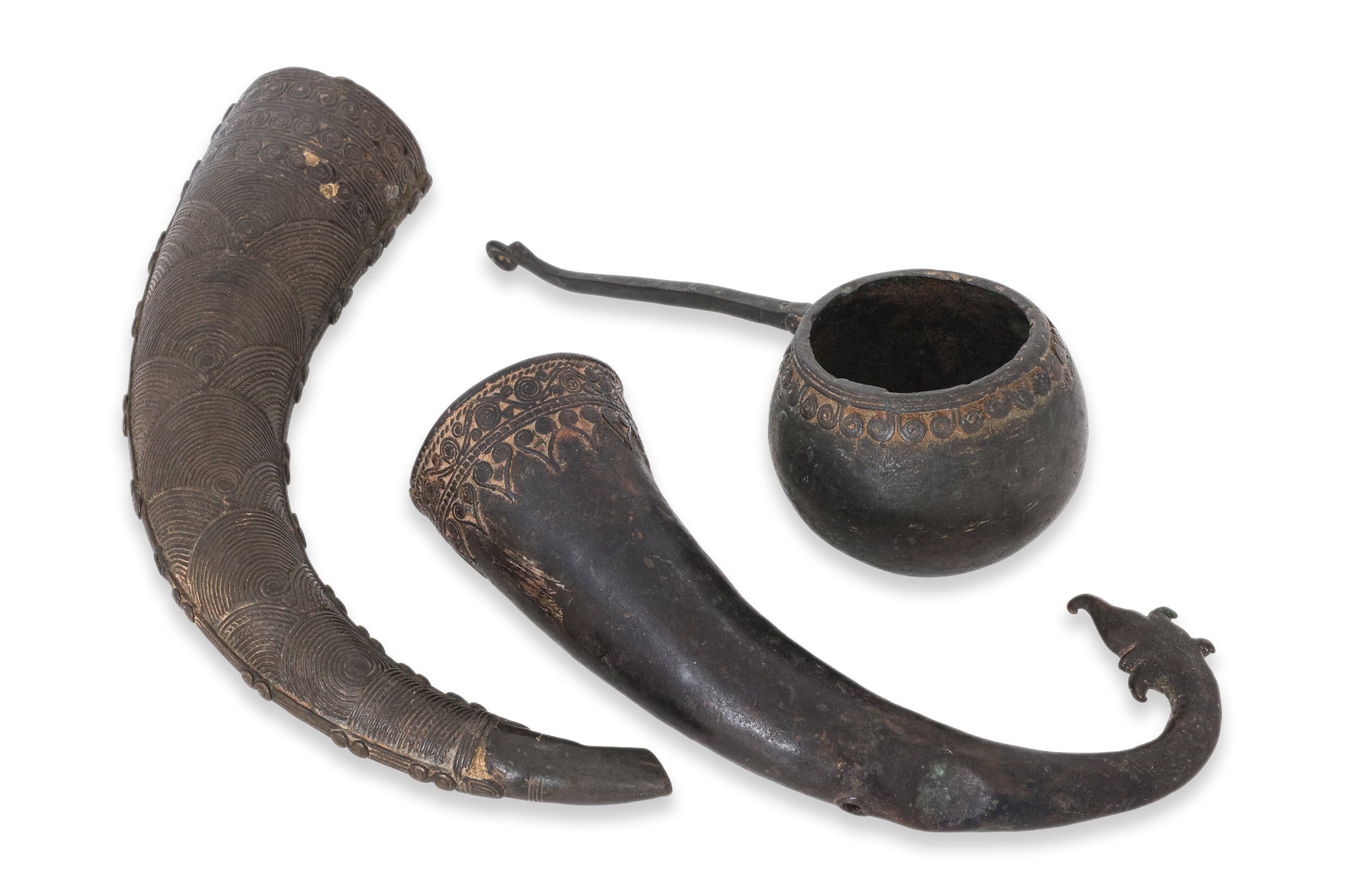 TWO SOUTHEAST ASIAN BRONZE 'RHYTON' DRINKING VESSELS AND A LADLE