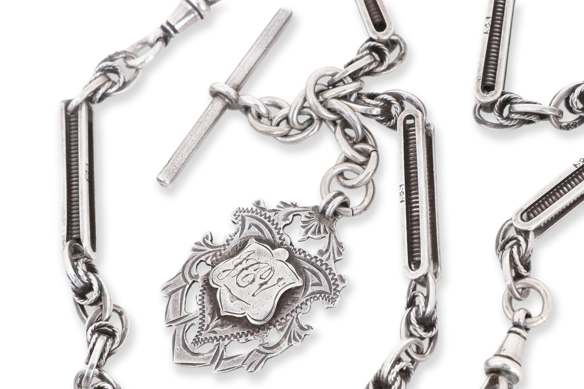 A GROUP OF THREE PIECES OF ANTIQUE SILVER JEWELLERY