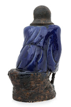 A LARGE SHIWAN POTTERY FIGURE OF A SEATED LUOHAN