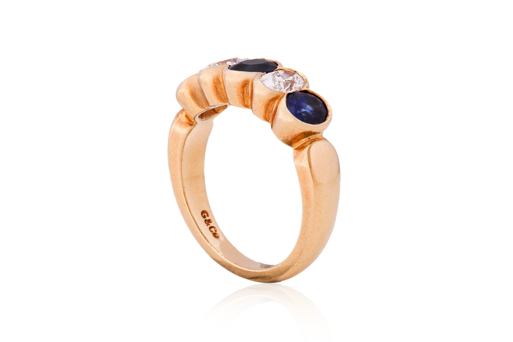A SAPPHIRE AND DIAMOND FIVE STONE RING