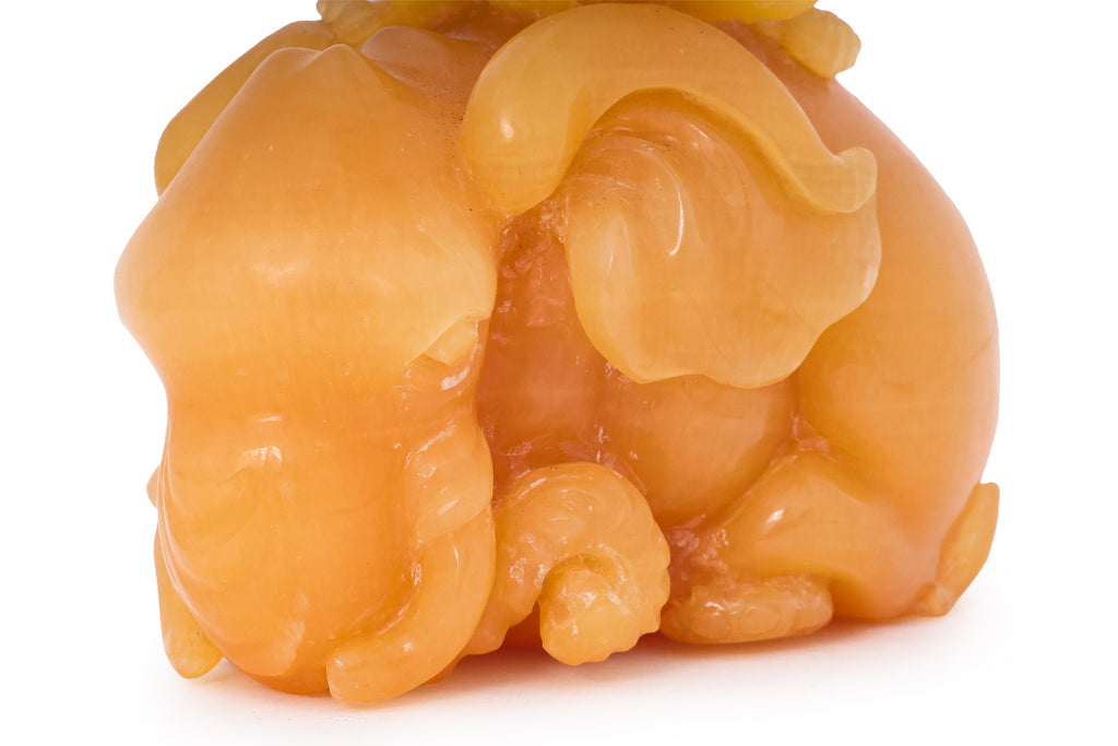 A YELLOW TIANHUANG-TYPE STONE MODEL OF AN ELEPHANT AND MONKEY