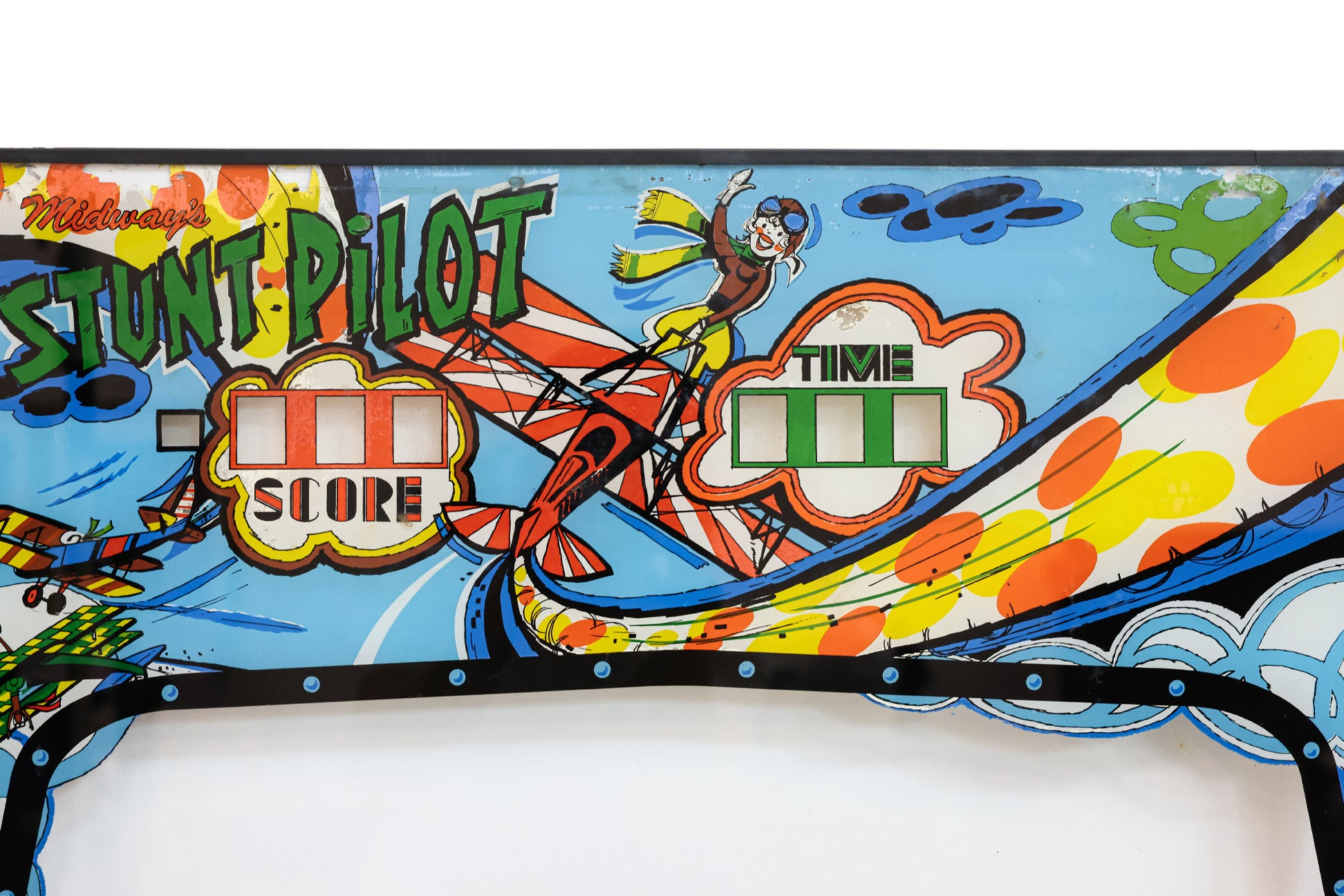 A MIDWAY 'STUNT PILOT' ARCADE MACHINE UPPER GLASS PANEL