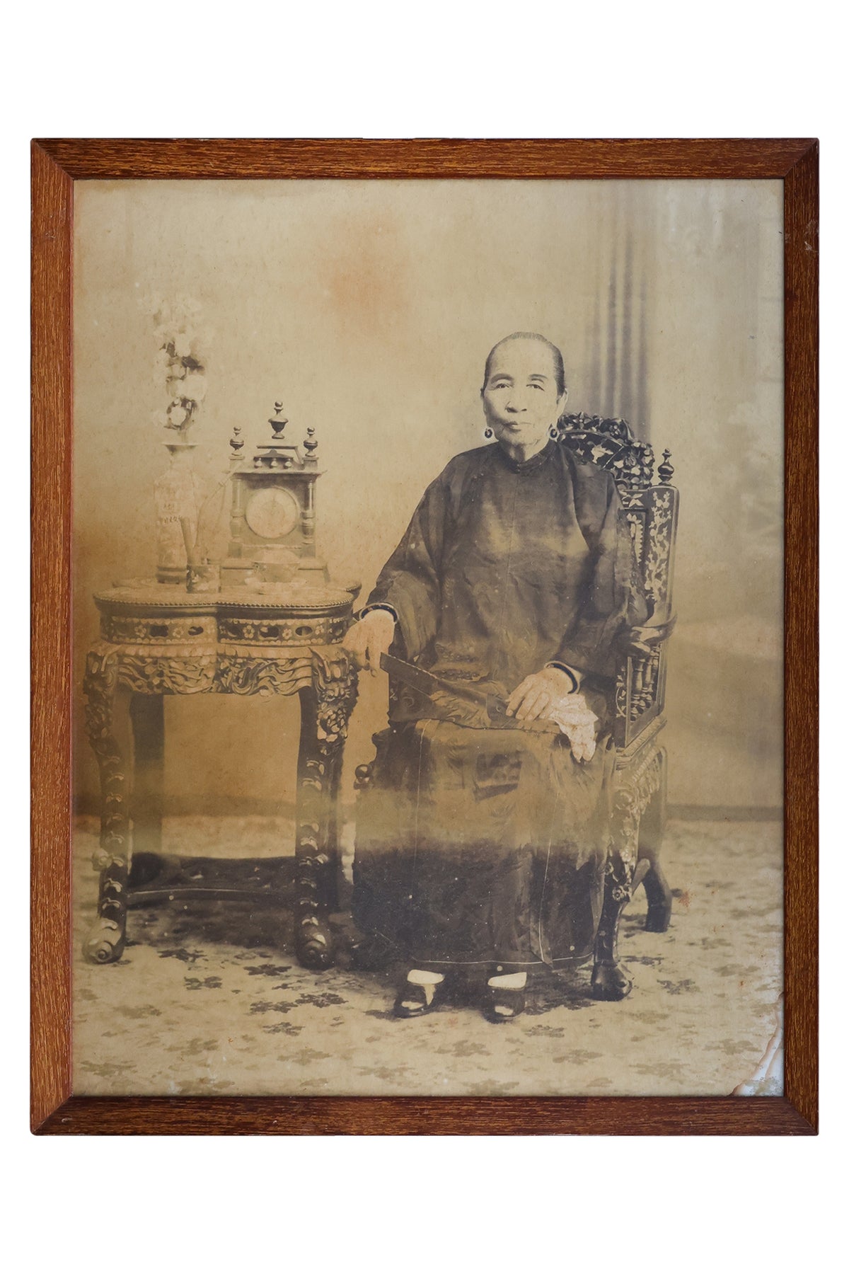 A LARGE-FORMAT PHOTOGRAPHIC PORTRAIT OF A SEATED NYONYA LADY