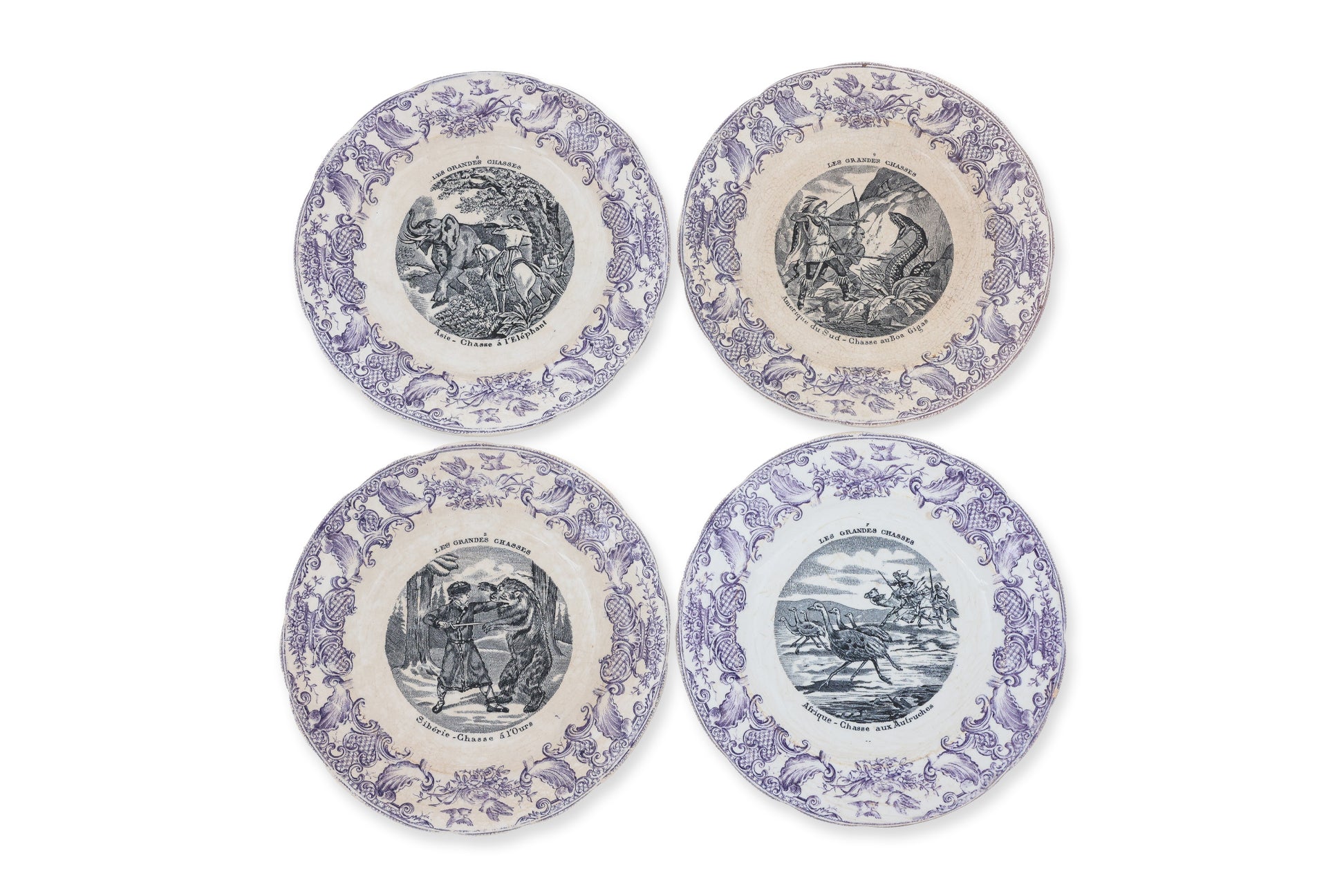 A PART SET OF FOUR FRENCH OPAQUE DE GIEN 'LES GRANDE CHASSES' PORCELAIN PLATES
